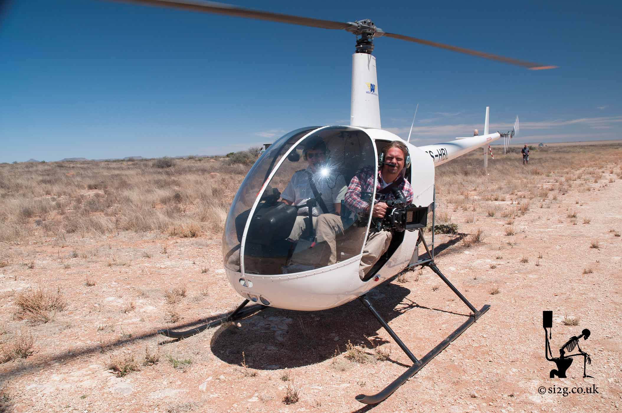 Aerial Filming - Aerial Filming the old-fashioned way.  With the door removed the Robinson Helicopter is an extremely exciting way to film South Africa and its wildlife.  We were able to get fairly smooth tracking shots of a 4x4 driving across rough desert.  The pilot used to round up cattle on a farm using a helicopter and proceeded to demonstrate this out over the desert.  Of course, today you