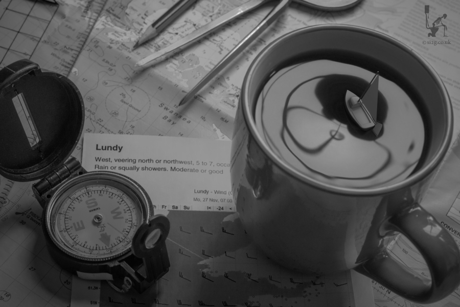 Storm in a Coffee Cup - Not being a big fan of black and white photography I wanted to make a series of images that went a little bit further with their visual impact.  Inspired by the saying Storm In A Teacup.  This nautical chart of Swansea Bay forms the backdrop for a scene of compass, dividers, shipping forecast and a sailing boat stuck in a mug of coffee.  A metaphor for my life in Swansea, if you will.